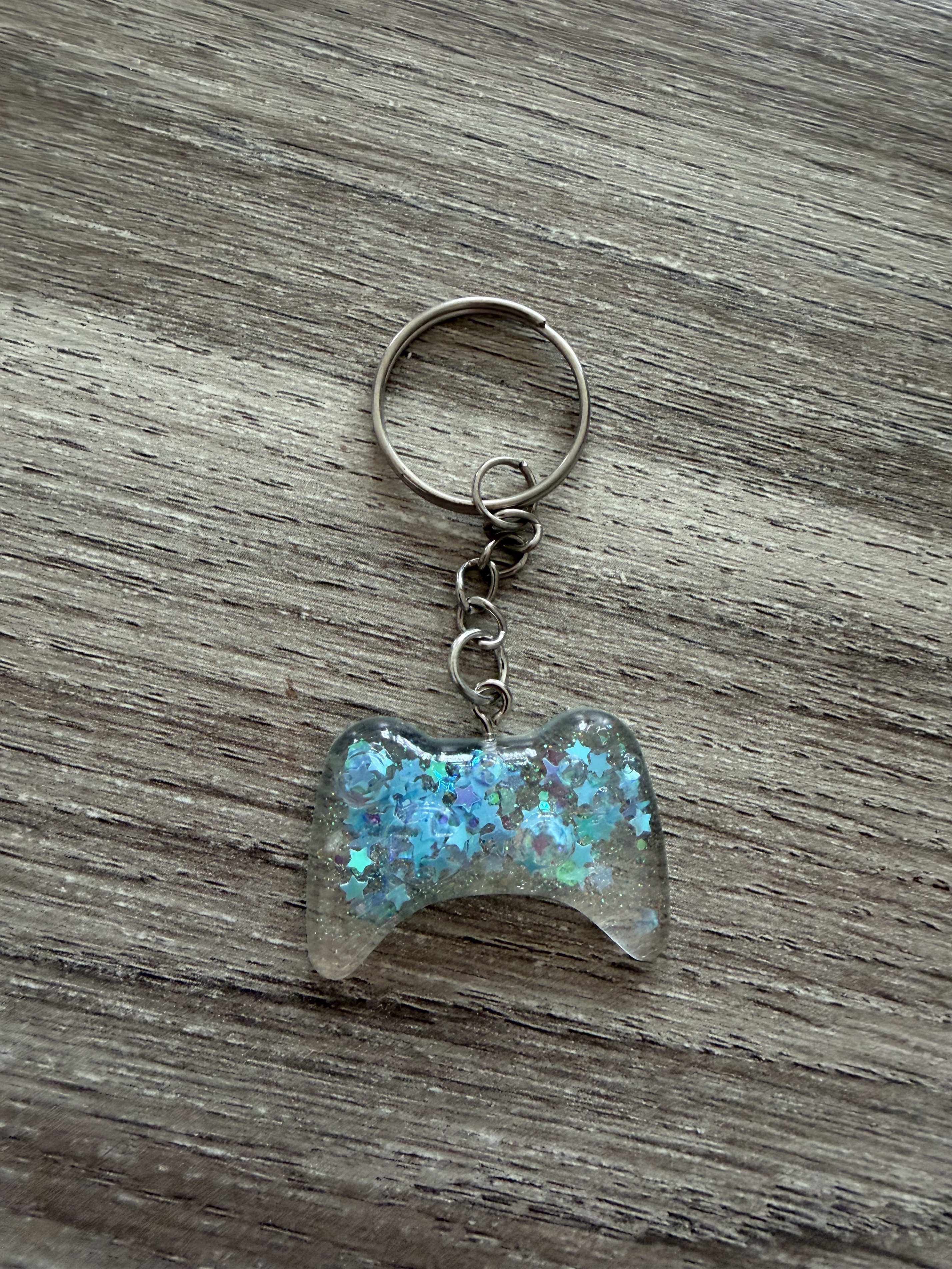 Porte clé manette 3 paillette étoile