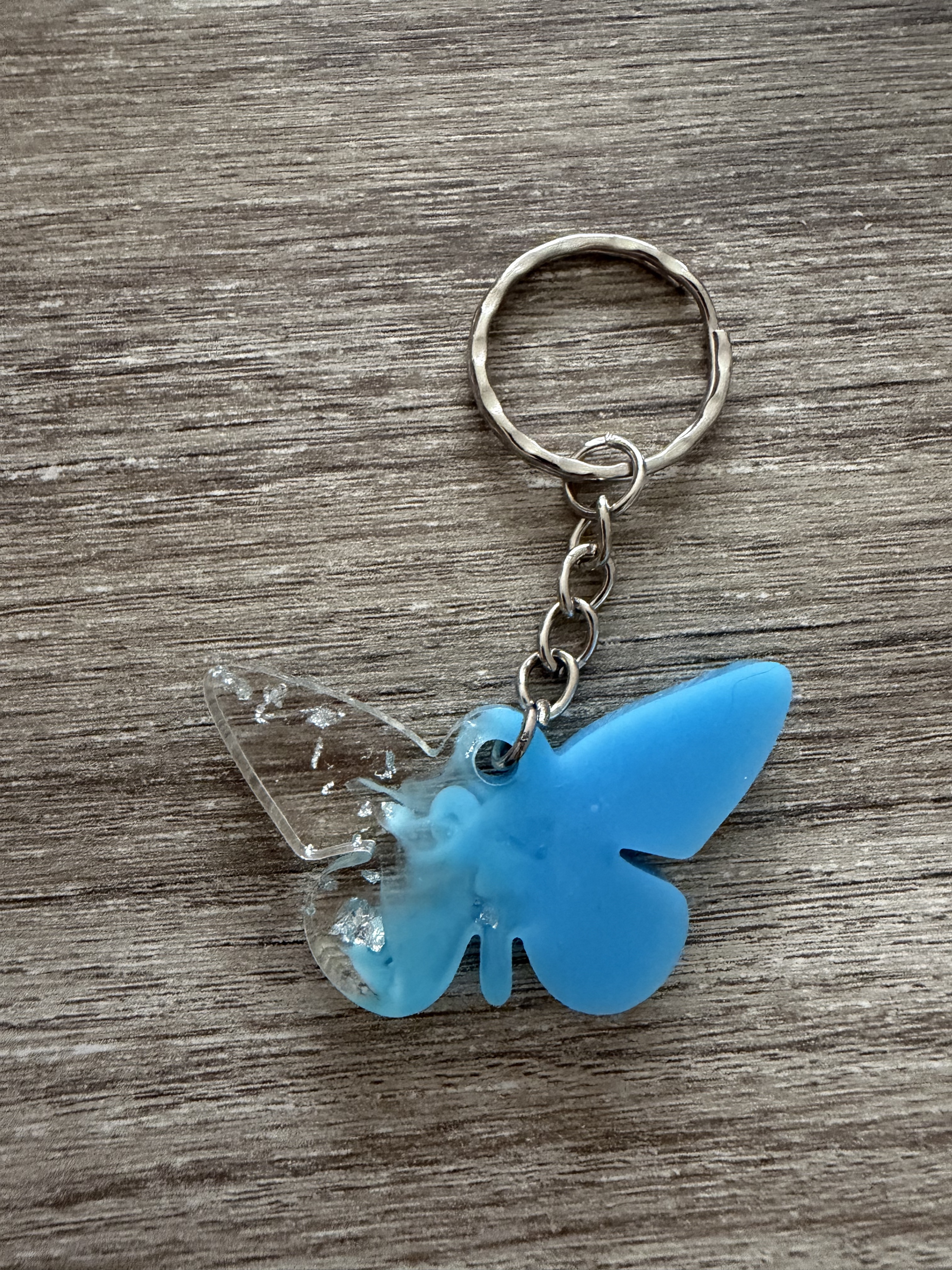 Porte clé papillon bleu feuille argent