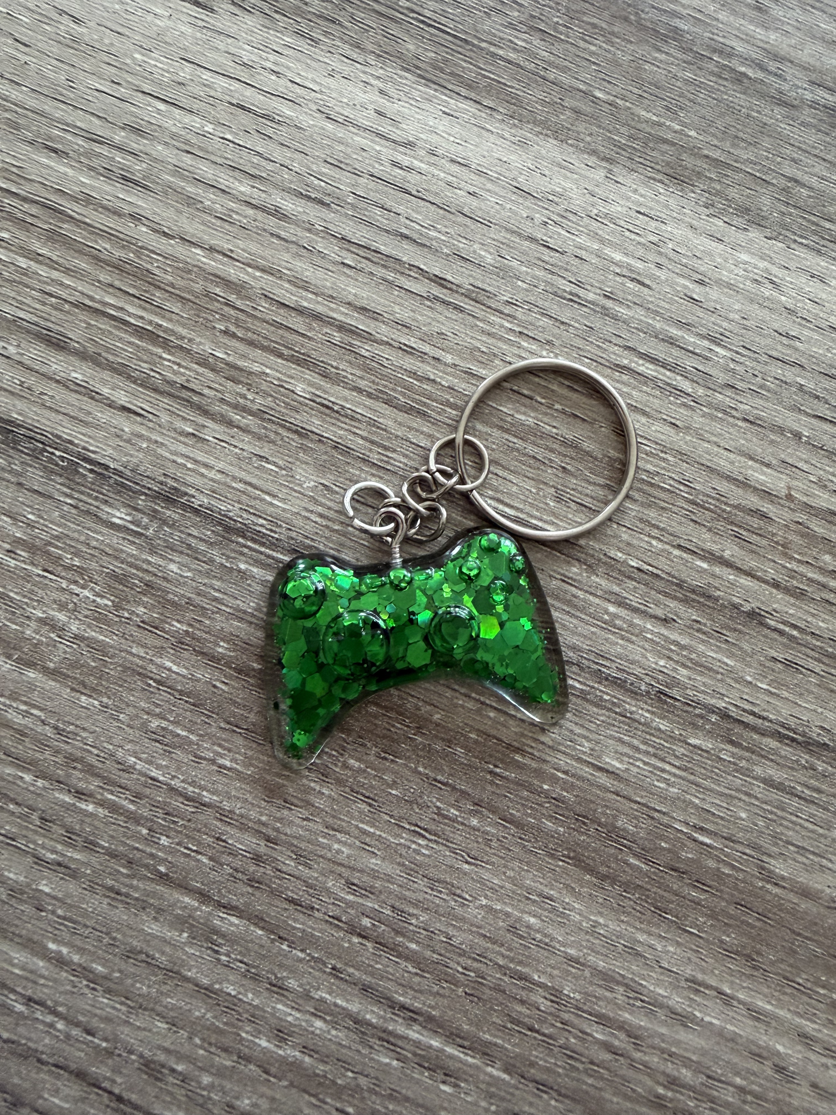 Porte clé manette 3 paillette verte