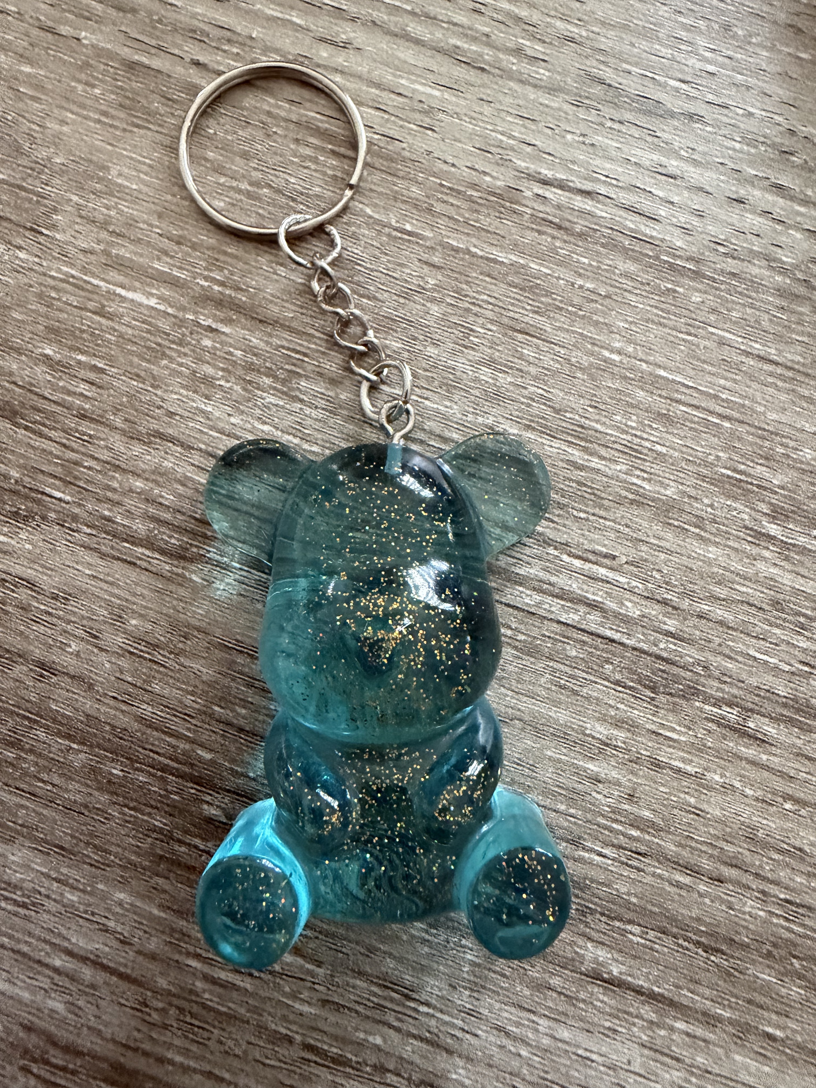 Porte clé ourson 55mm bleu translucide pailleté