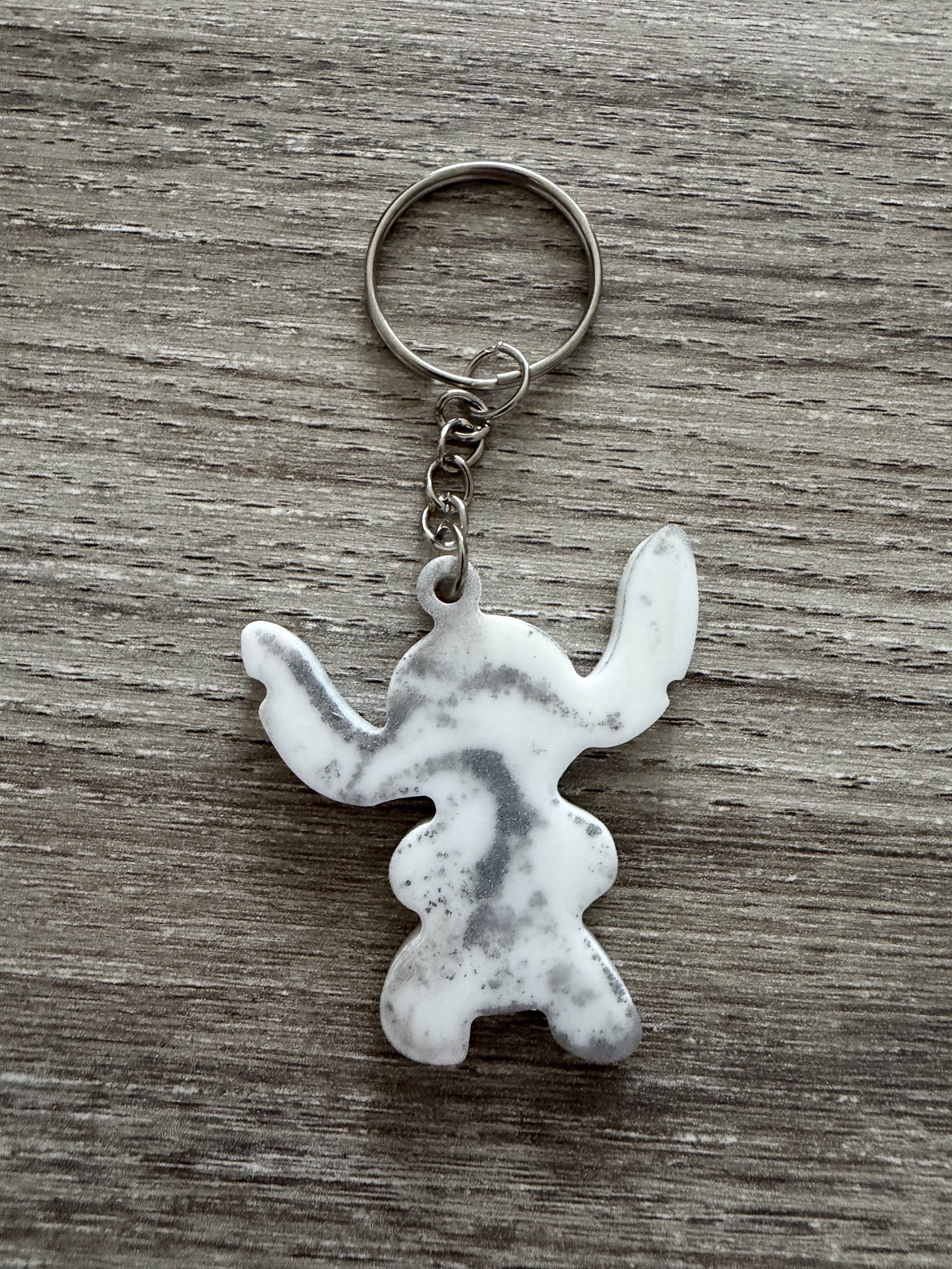 Porte clé monstre blanc argent