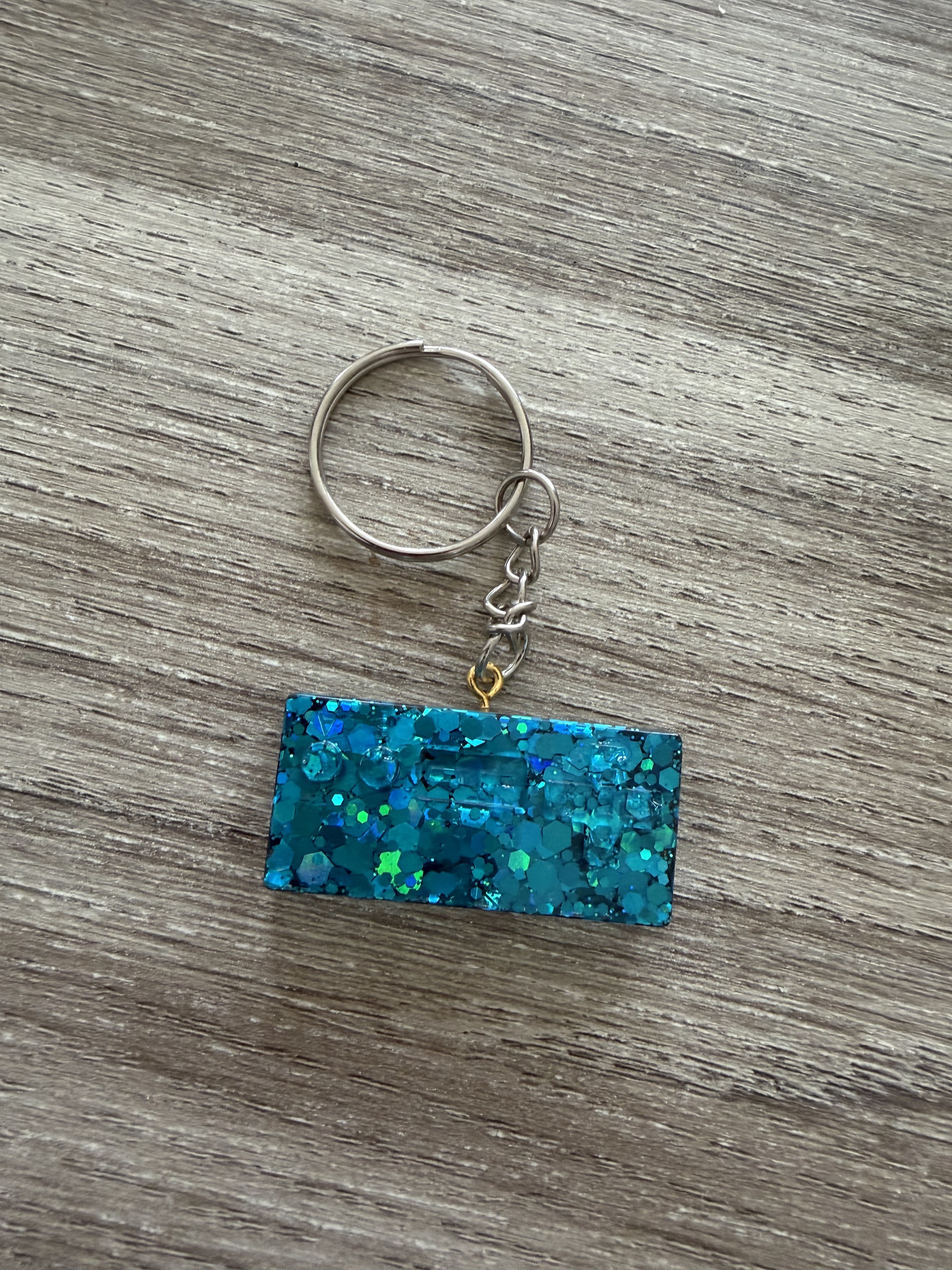 Porte clé manette 4 paillette bleue