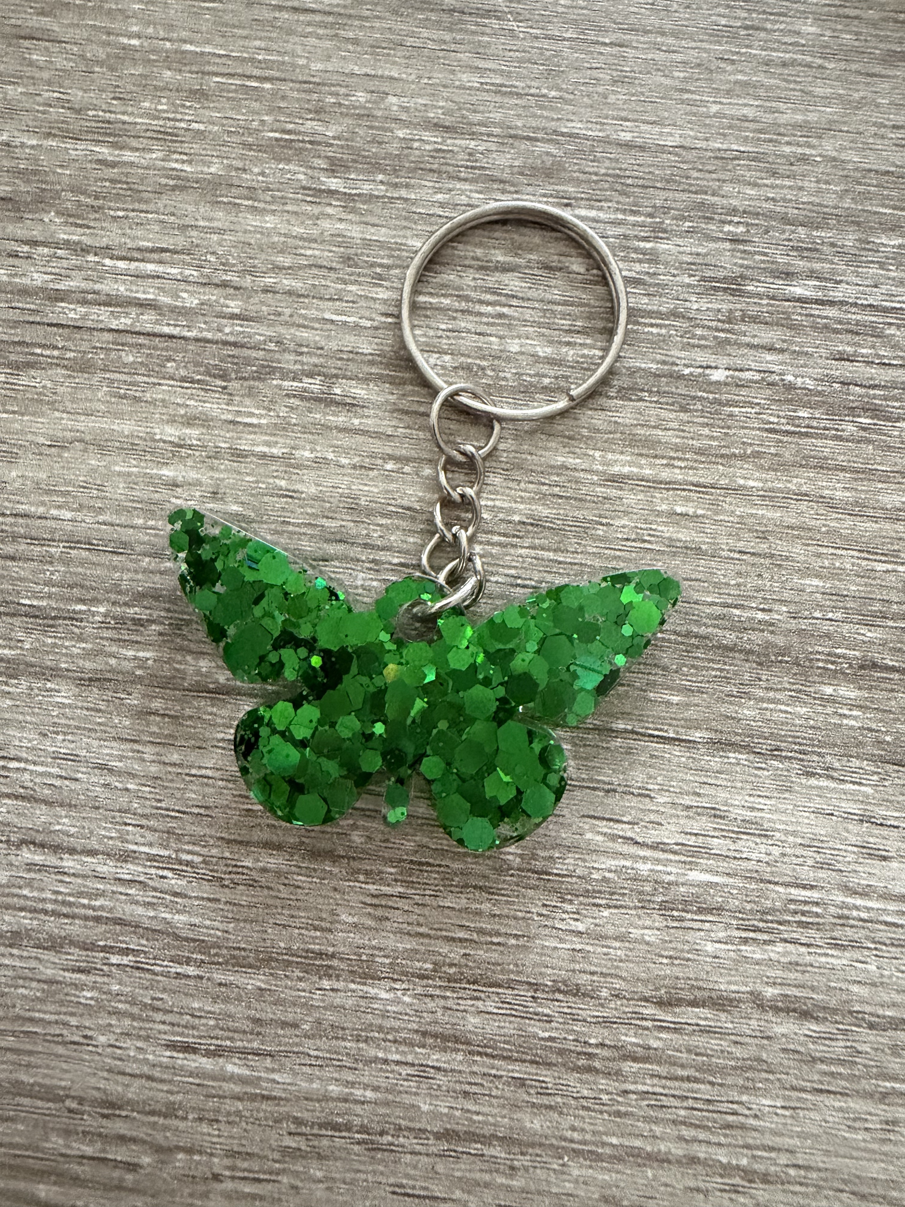 Porte clé papillon paillette verte