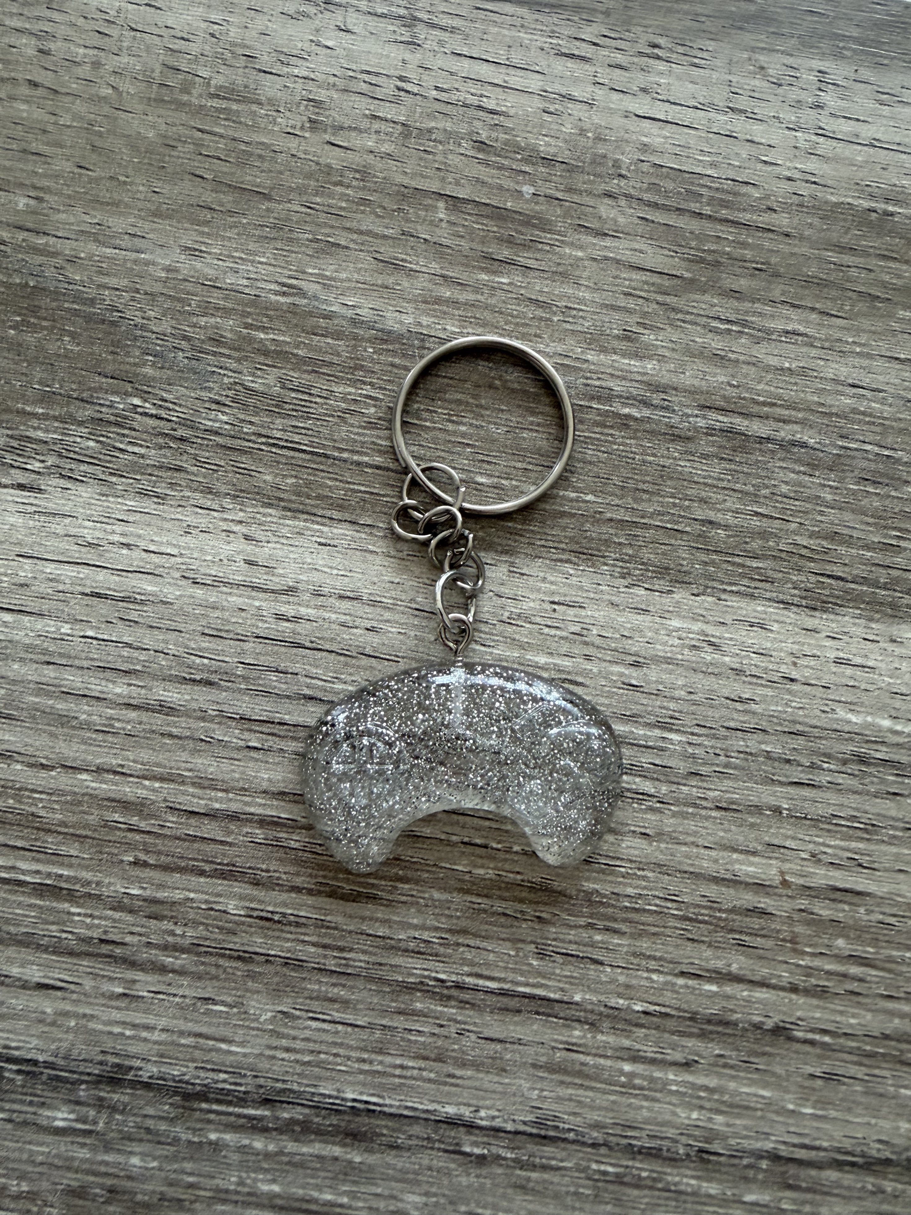 Porte clé manette paillettes argentées